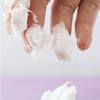 Applying Eqqualberry Bakuchiol Cream - capsules bursting on hands