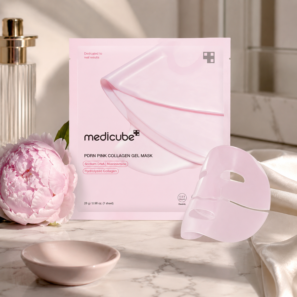 Medicube Salmon PDRN Pink Jelly Mask with pink florals and collagen droplets