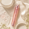 Medicube Collagen Glow Booster Serum with milk splash and collagen droplets