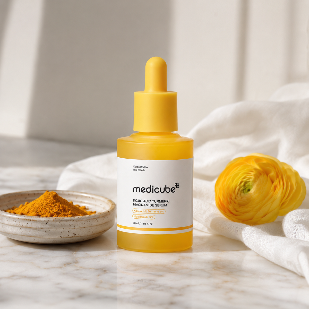 Medicube Kojic Acid Turmeric Niacinamide Serum on white marble vanity