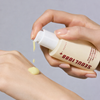 K-Secret Retinal Liposome Serum golden droplets on glass surface