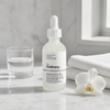 The Ordinary Hyaluronic Acid 2% + B5 Ceramides on white marble vanity