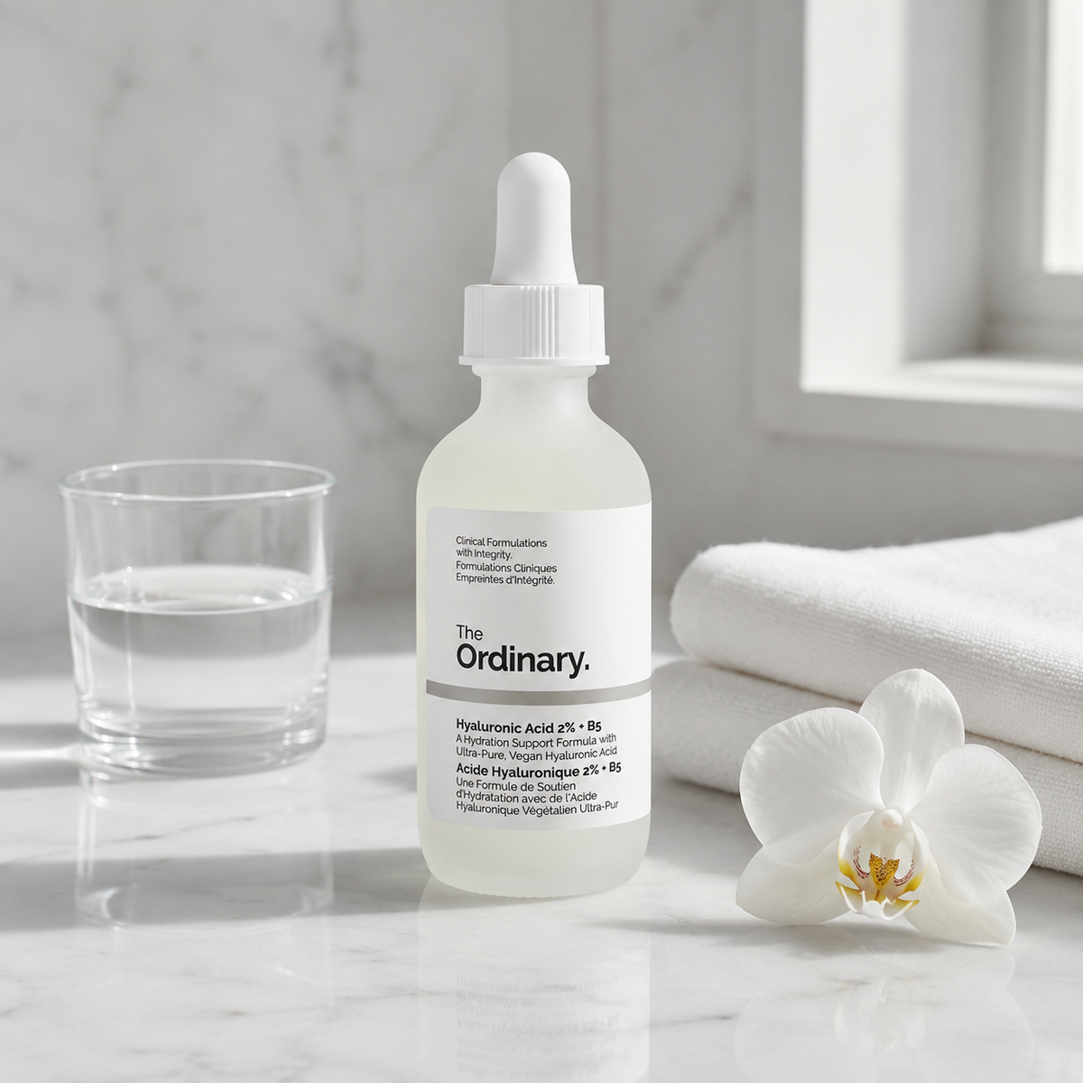 The Ordinary Hyaluronic Acid 2% + B5 Ceramides on white marble vanity